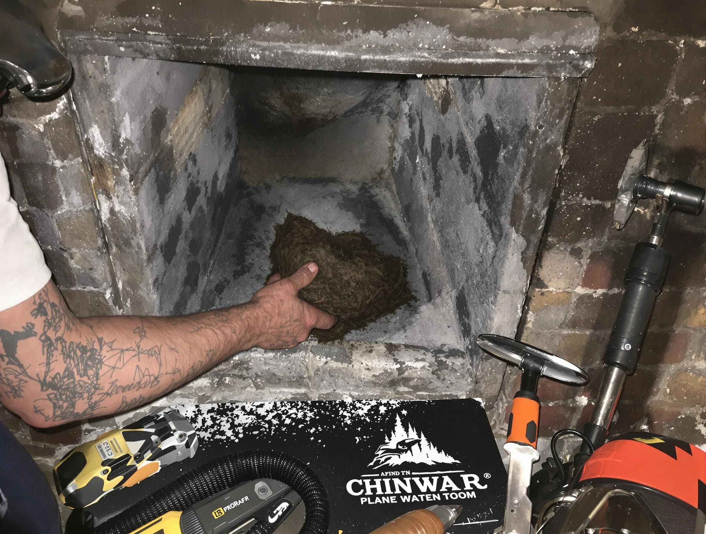 Evans Chimney Sweep safely removing debris and screening chimney in Evans, CO